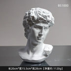 Esculturas decorativas de bustos de figuras da mitologia grega