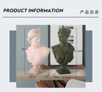 Esculturas decorativas de bustos de figuras da mitologia grega